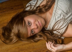 high school senior girl on floor of studio by Dan Iott Photography
