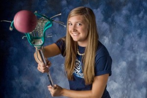 High school senior with her lacross stick by Dan Iott Photography